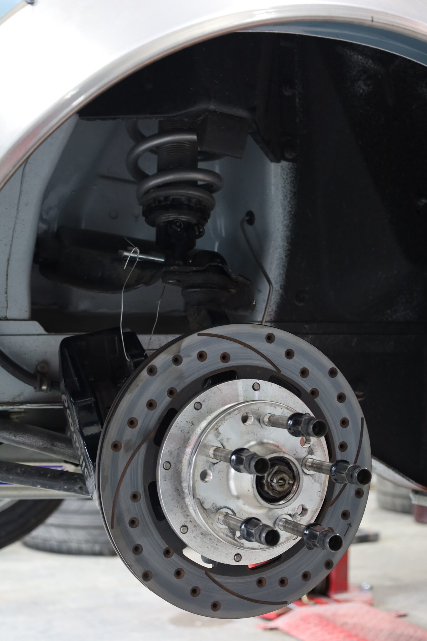 Brake assembly and suspension in the Talus workshop